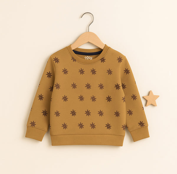 Girls’ camel sweatshirt with brown flower print laid flat on wooden surface – winter kidswear by Yumi.pk