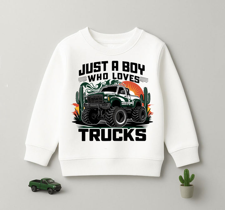 White kids sweatshirt with green monster truck graphic and “Just a Boy Who Loves Trucks” print – Yumi.pk.