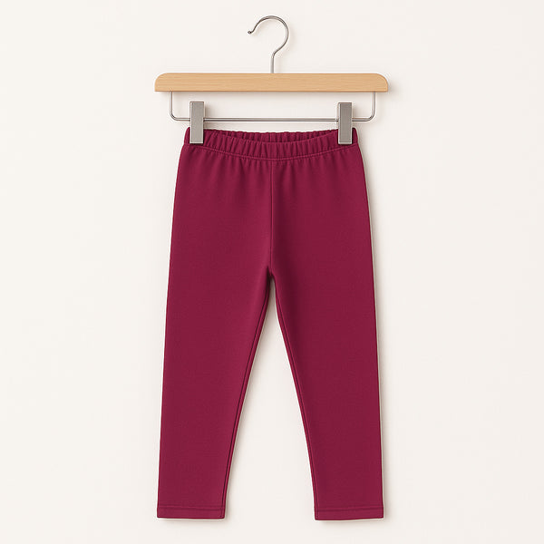 Burgundy rib winter girls leggings/tights hanging on a hanger