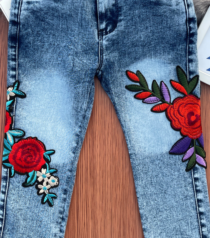 Girls Blue Jeans with Multicolor Embroidery Patch - YUMI.PK